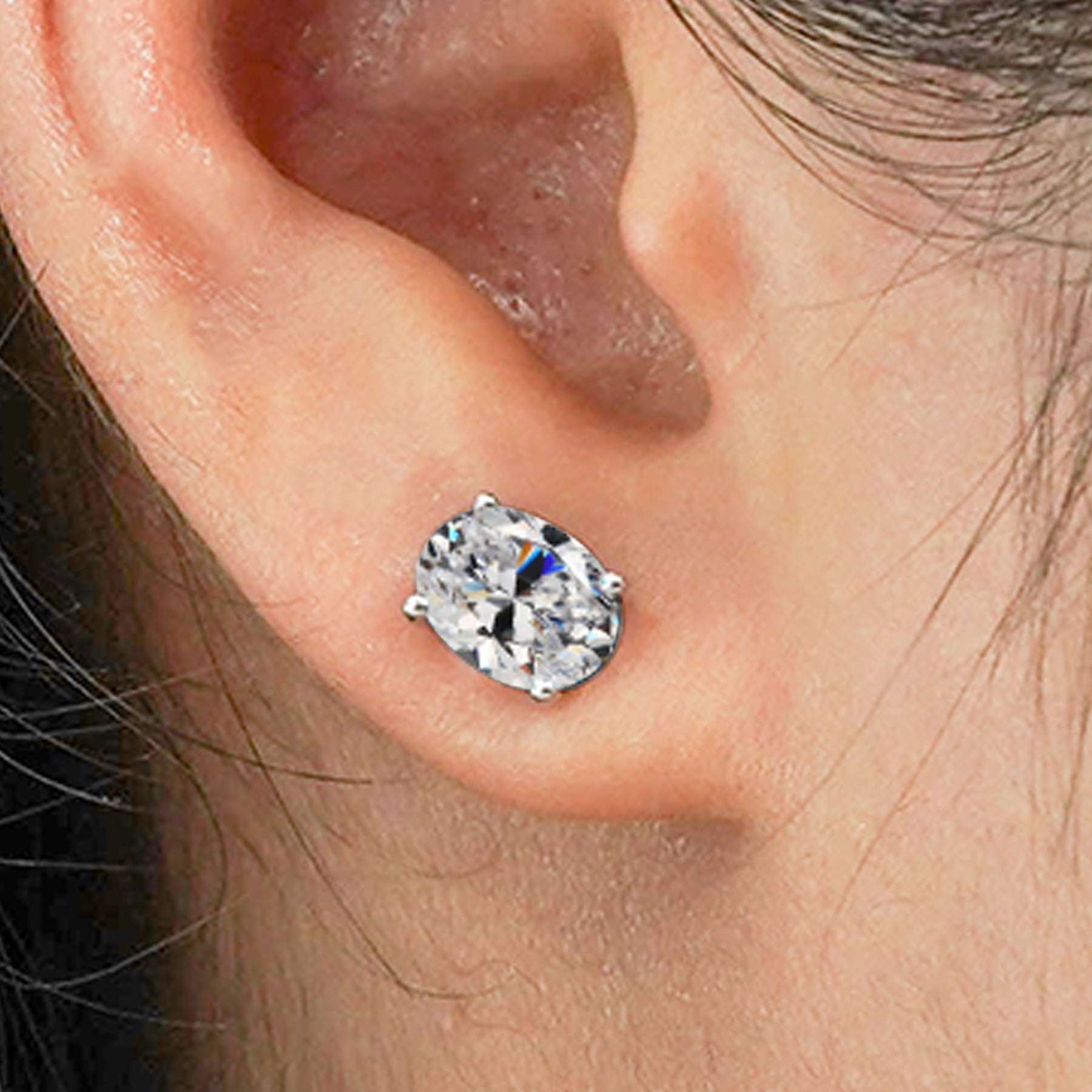 2.5 Carat Oval Cut - SWAROVSKI Cubic Zirconia - April Birthstone Solitaire Stud Earrings - 4 Prong - In 18K White Gold Plating Over Silver