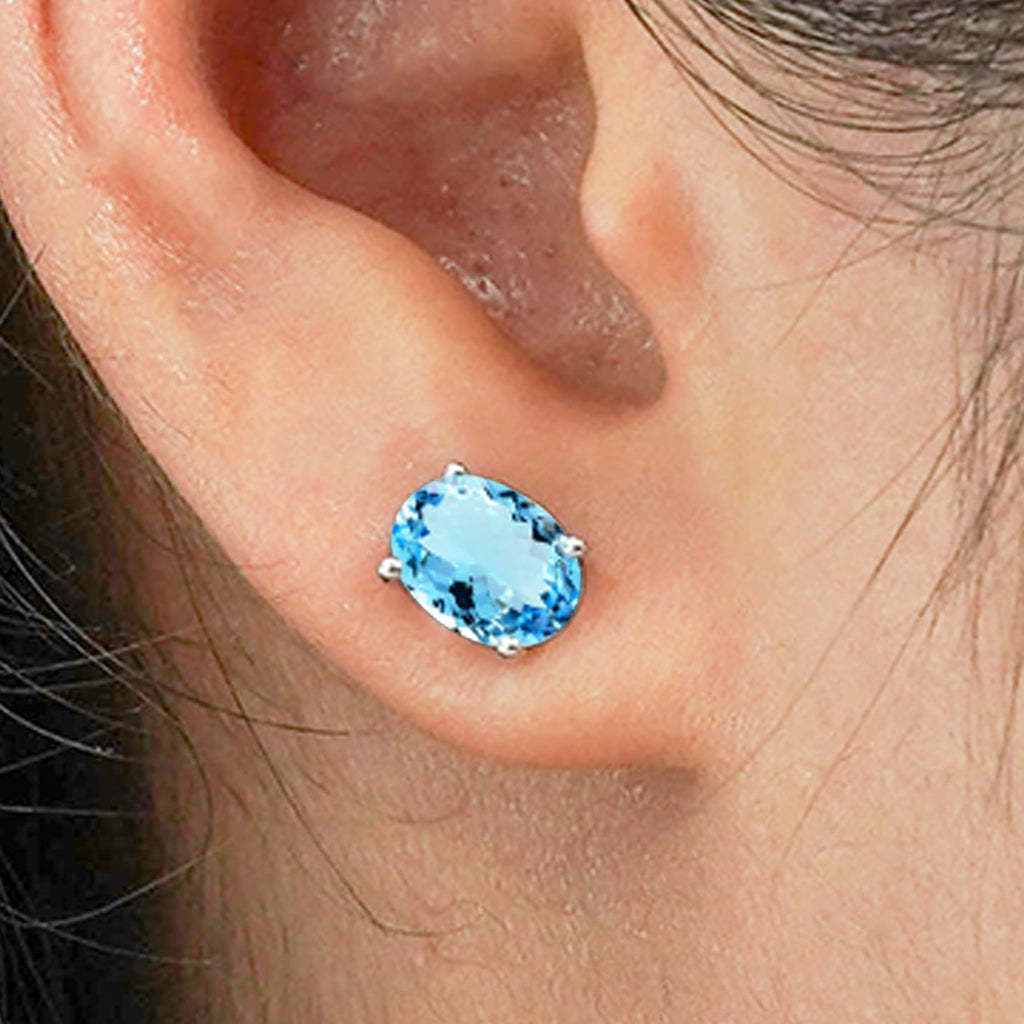 2.5 Carat Oval Cut - SWAROVSKI Blue Topaz - December Birthstone Solitaire Stud Earrings - 4 Prong - In 18K White Gold Plating Over Silver