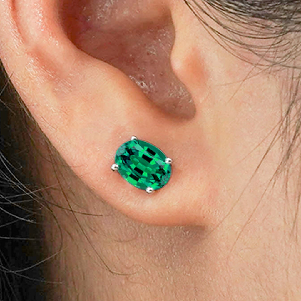 2.5 Carat Oval Cut - SWAROVSKI Emerald - May Birthstone Solitaire Stud Earrings - 4 Prong - In 18K White Gold Plating Over Silver