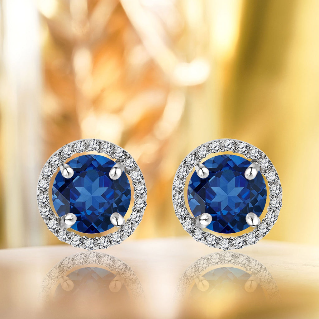 1.25 Carat Round Cut SWAROVSKI Blue Sapphire September Birthstone Halo Stud Earrings in 18K White Gold over Silver