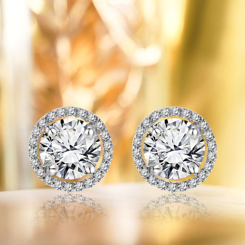 1.25 Carat Round Cut SWAROVSKI Cubic Zirconia April Birthstone Halo Stud Earrings in 18K White Gold over Silver