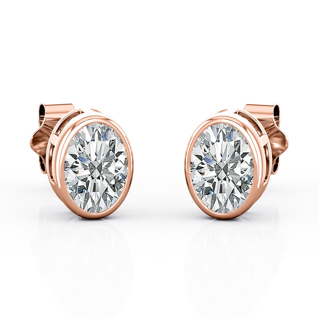 JeenMata Bezel Set 1 Carat Oval Shaped Moissanite Solitaire Stud Earrings In 18K White Gold Plating Over Silver