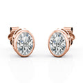 JeenMata Bezel Set 1 Carat Oval Shaped Moissanite Solitaire Stud Earrings In 18K White Gold Plating Over Silver