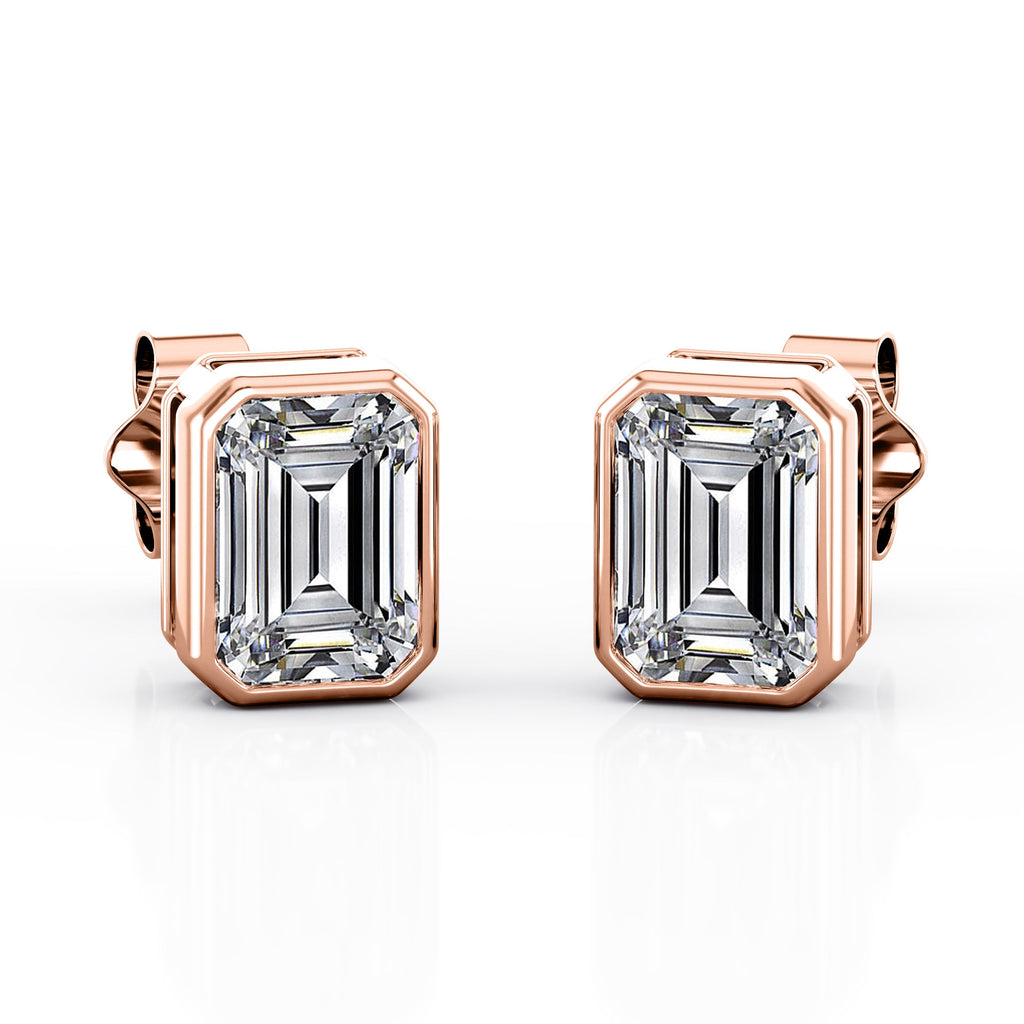 JeenMata Bezel Set 1 Carat Emerald Shaped Moissanite Solitaire Stud Earrings In 18K White Gold Plating Over Silver