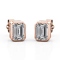 JeenMata Bezel Set 1 Carat Emerald Shaped Moissanite Solitaire Stud Earrings In 18K White Gold Plating Over Silver