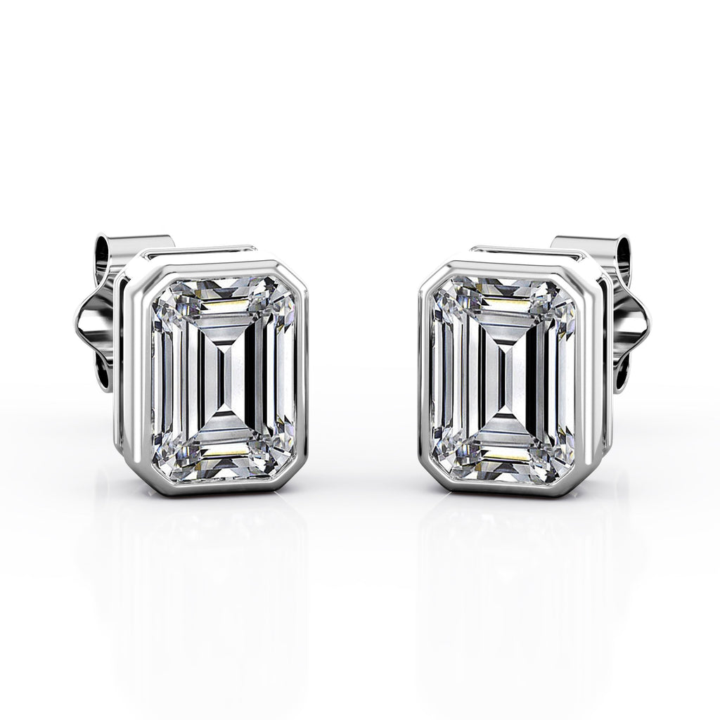 JeenMata Bezel Set 2 Carat Emerald Shaped Moissanite Solitaire Stud Earrings In 18K White Gold Plating Over Silver