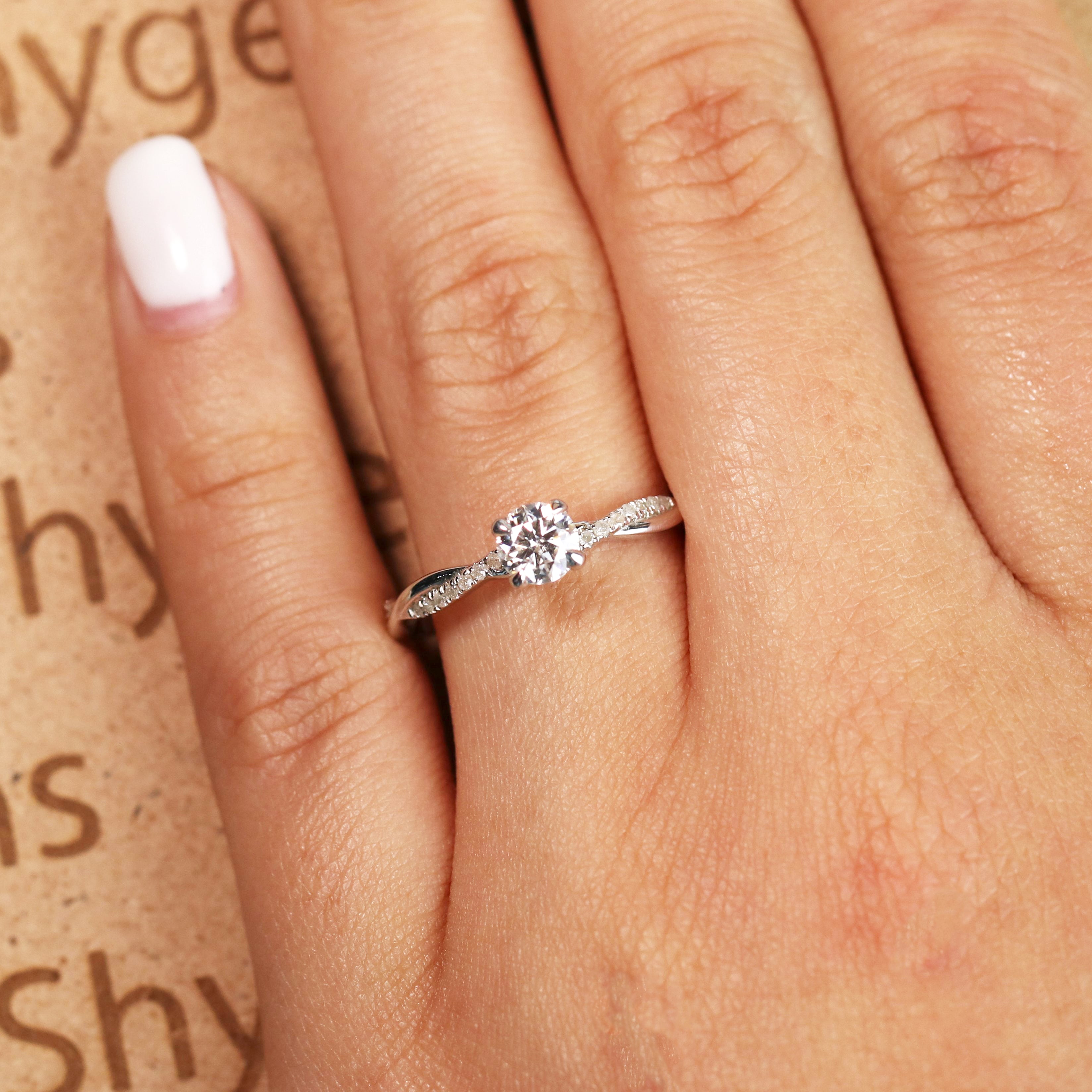 JeenMata Cathedral Prong 1 Carat Round Shaped Moissanite Half Pave Infinity Twisted Shank Engagement Ring In 18K White Gold Plating Over Silver