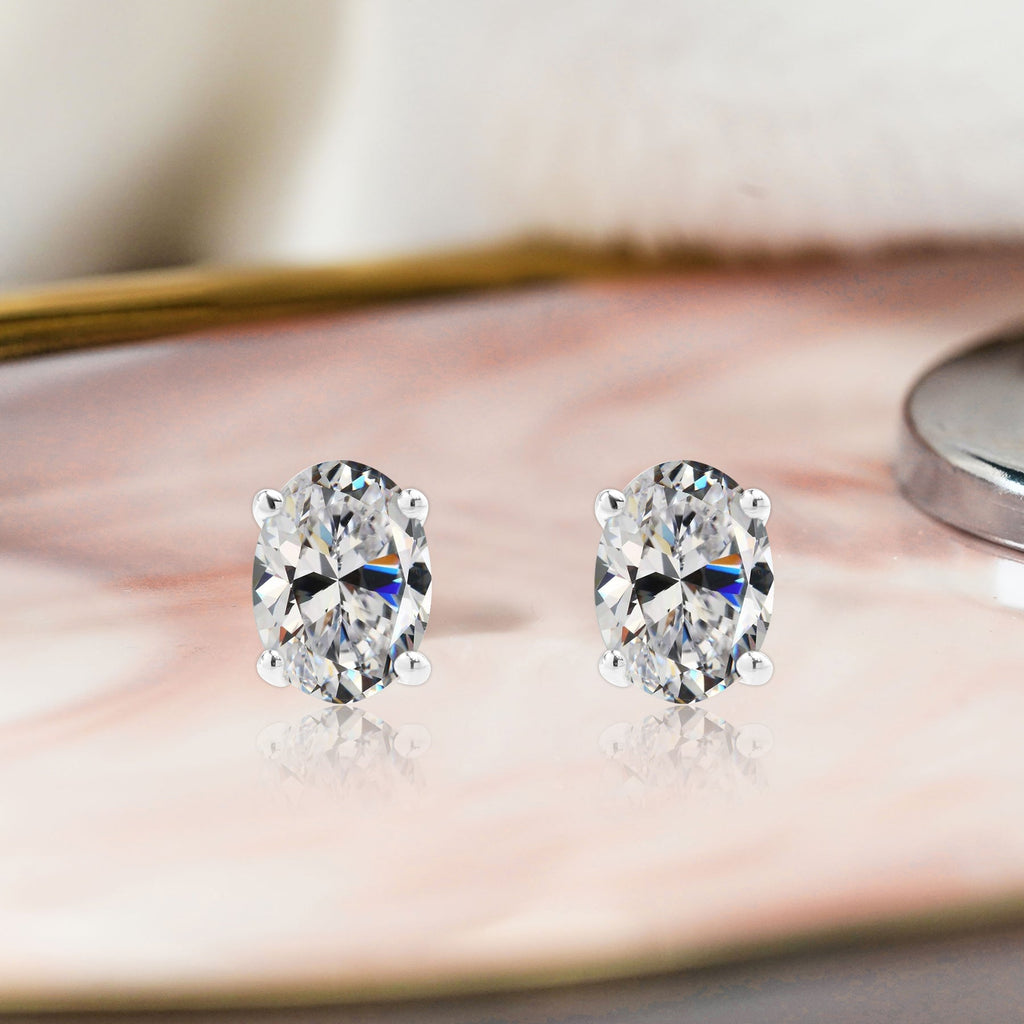 2.5 Carat Oval Cut - SWAROVSKI Cubic Zirconia - April Birthstone Solitaire Stud Earrings - 4 Prong - In 18K White Gold Plating Over Silver