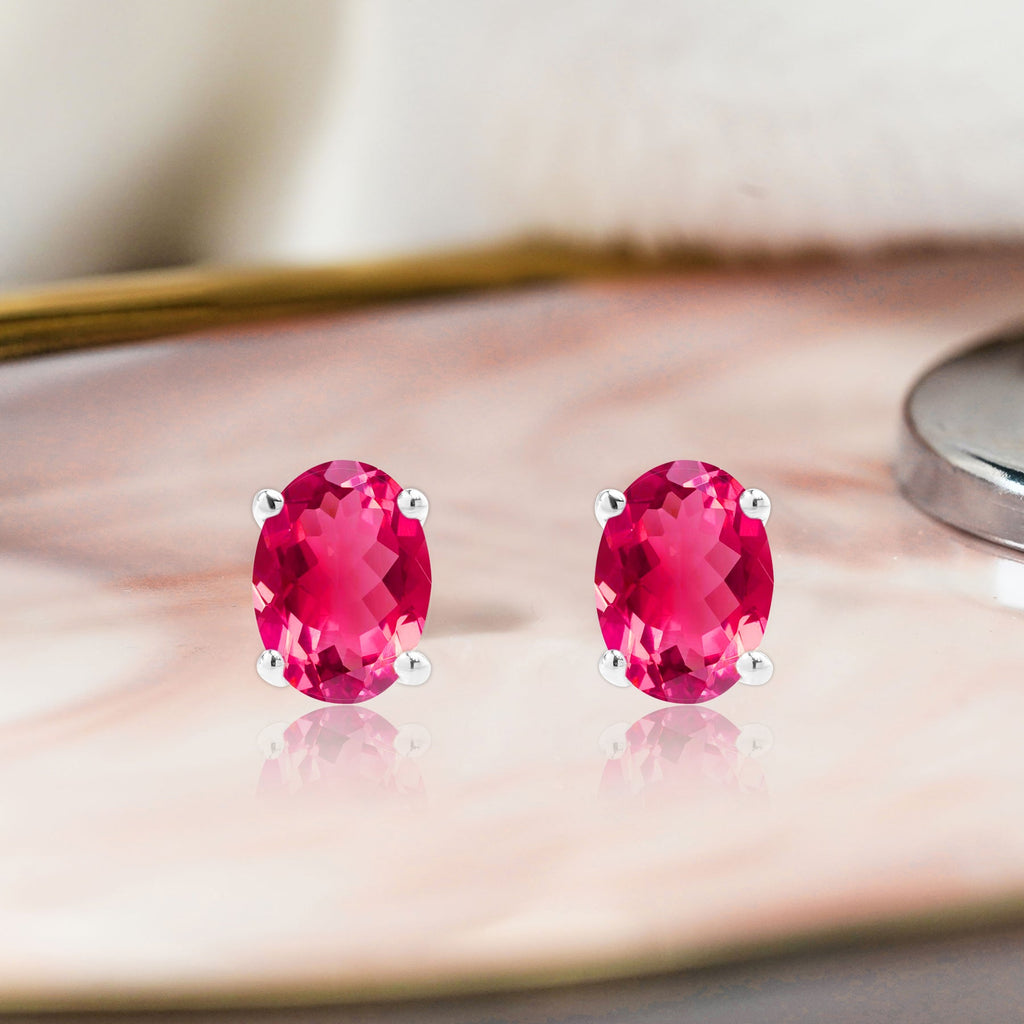 2.5 Carat Oval Cut - SWAROVSKI Ruby - July Birthstone Solitaire Stud Earrings - 4 Prong - In 18K White Gold Plating Over Silver