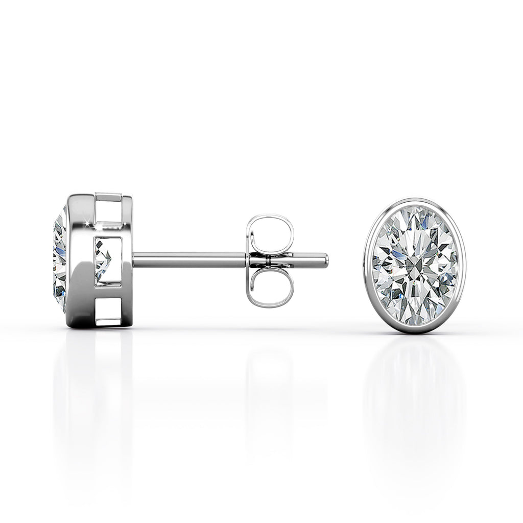 JeenMata Bezel Set 1 Carat Oval Shaped Moissanite Solitaire Stud Earrings In 18K White Gold Plating Over Silver