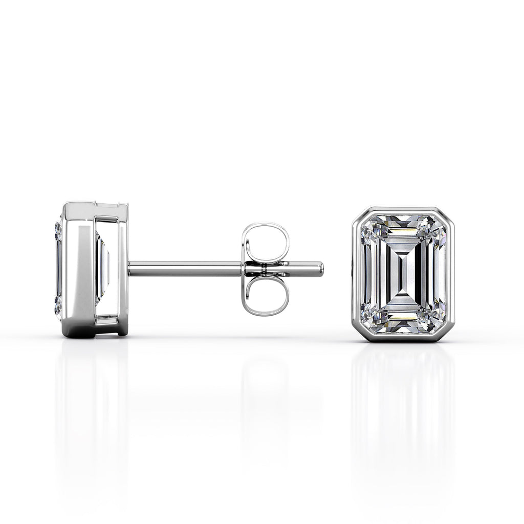 JeenMata Bezel Set 1 Carat Emerald Shaped Moissanite Solitaire Stud Earrings In 18K White Gold Plating Over Silver