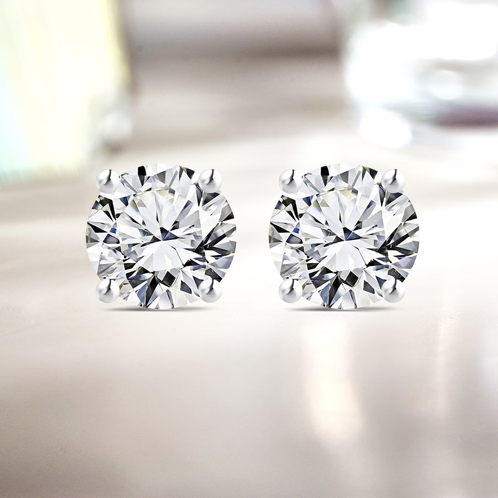 JeenMata 1 Carat Round Shaped Moissanite Solitaire Stud Earrings - 4 Prong - In 18K White Gold Plating Over Silver