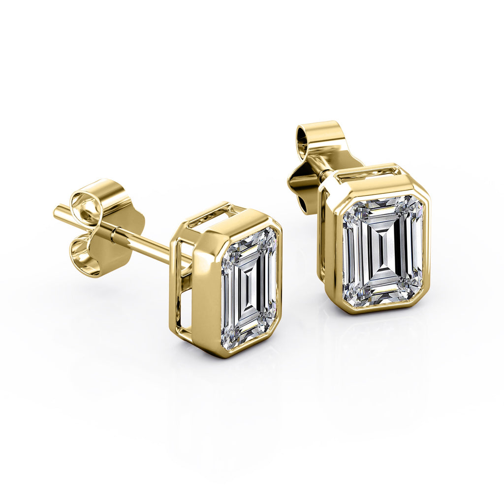 JeenMata Bezel Set 1 Carat Emerald Shaped Moissanite Solitaire Stud Earrings In 18K White Gold Plating Over Silver