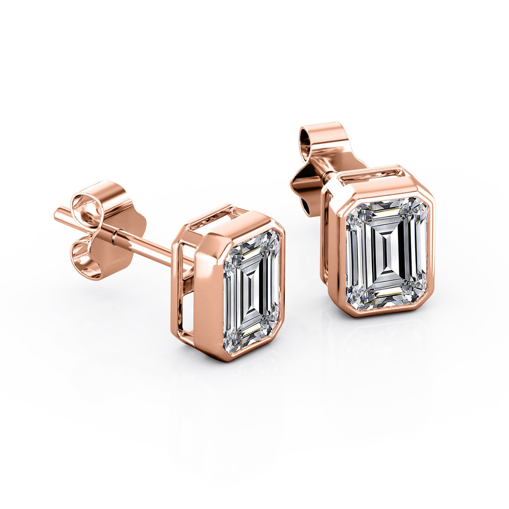 JeenMata Bezel Set 1 Carat Emerald Shaped Moissanite Solitaire Stud Earrings In 18K White Gold Plating Over Silver