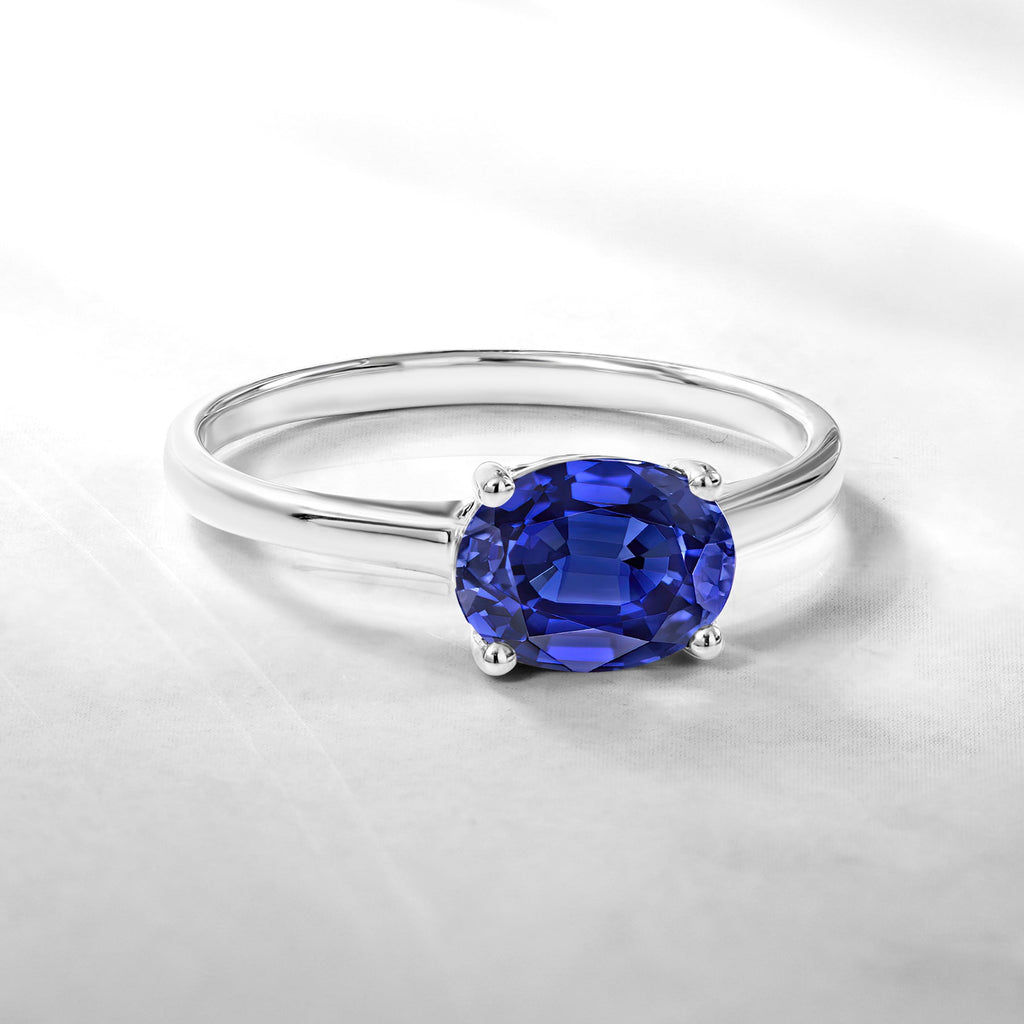 1.25 Carat Oval Cut Blue Sapphire SWAROVSKI - September Birthstone Solitaire Engagement Ring in 18k White Gold Over Silver