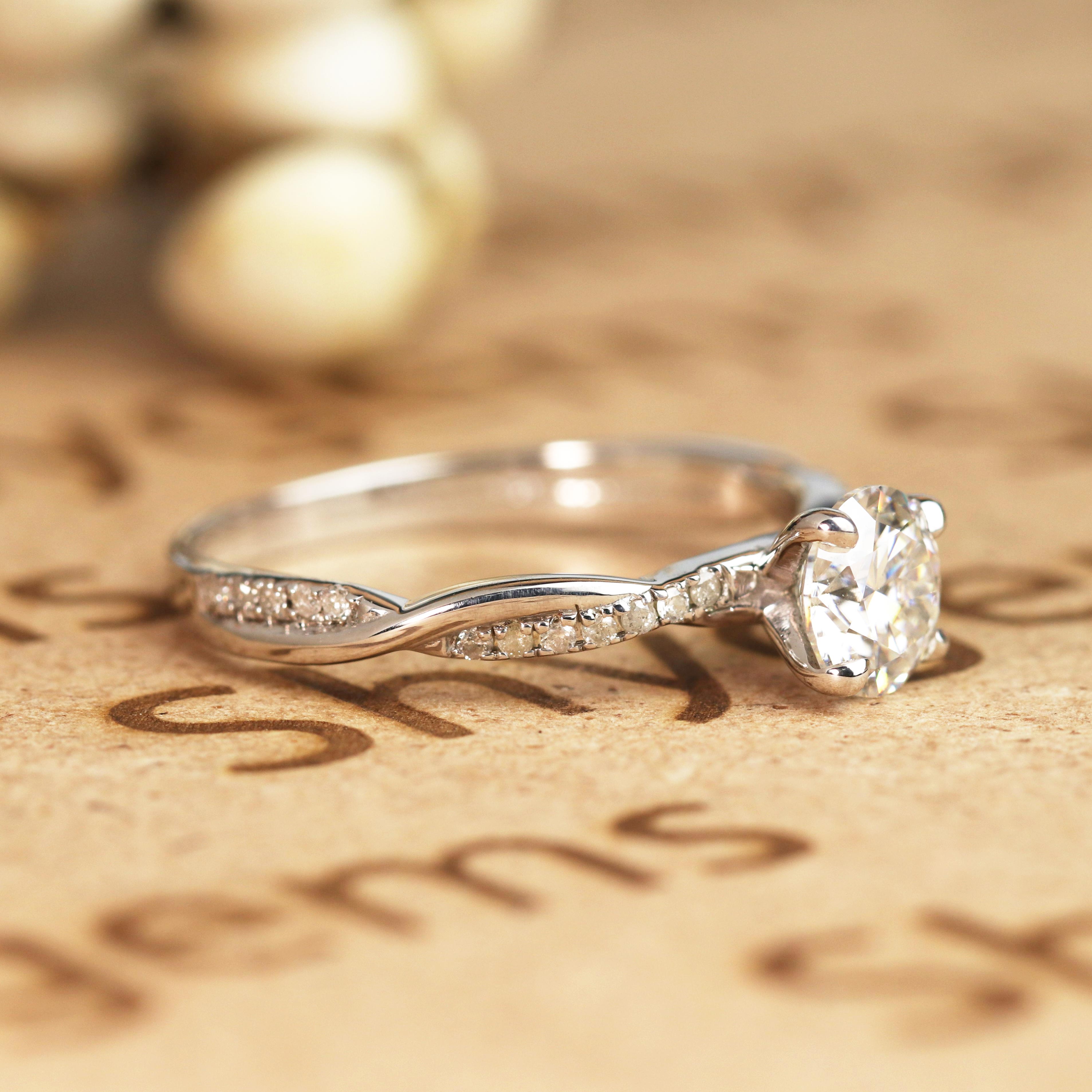 JeenMata Cathedral Prong 1 Carat Round Shaped Moissanite Half Pave Infinity Twisted Shank Engagement Ring In 18K White Gold Plating Over Silver