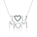 JeenMata I Love U Mom Ice Blue Stone Embellished Open Heart Pendant Necklace in 18K White Gold over Silver - March Birthstone - Gift for Mom