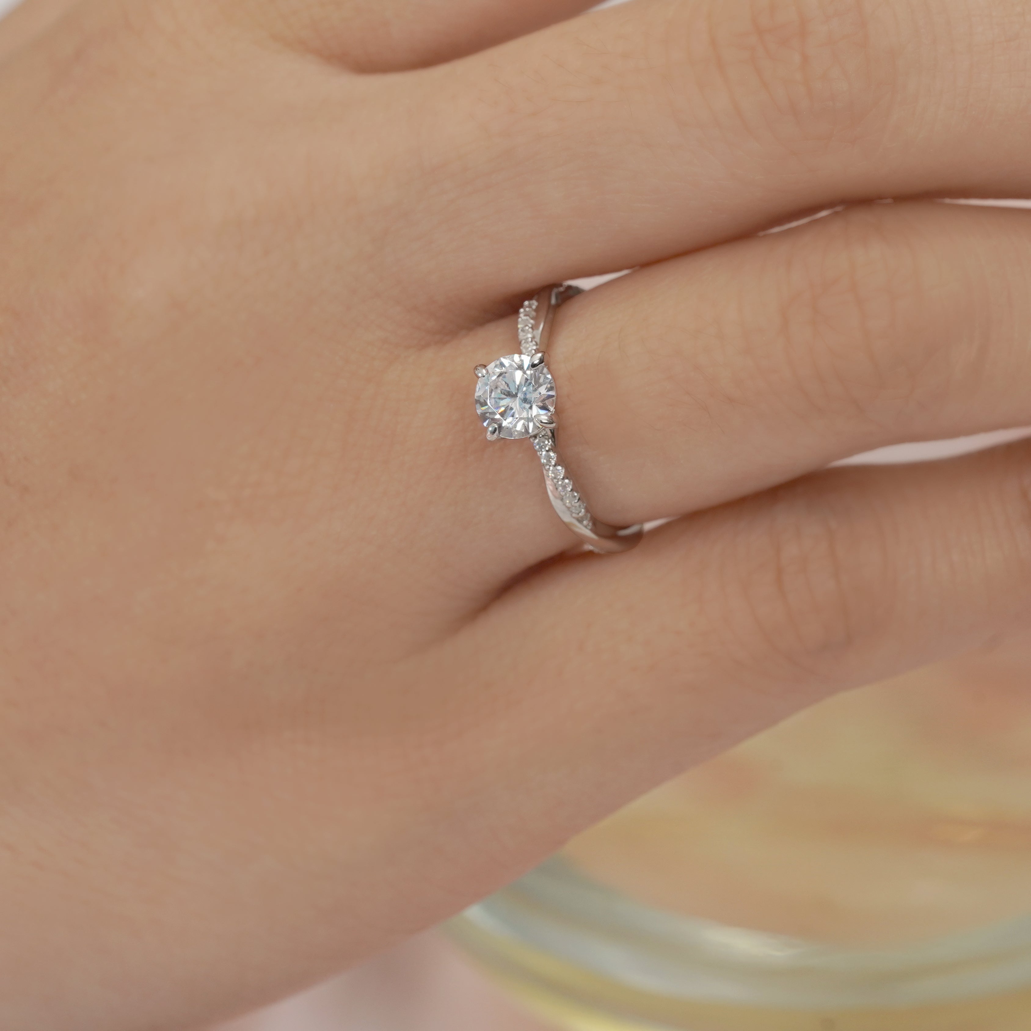 JeenMata Cathedral Prong 1 Carat Round Shaped Moissanite Half Pave Infinity Twisted Shank Engagement Ring In 18K White Gold Plating Over Silver