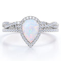 JeenMata 1.5 ct Pear Shaped Created Blue Opal and Moissanite Vintage Bridal Set - Infinity Twisted Wedding Ring Set in 18K White Gold Plating for Women