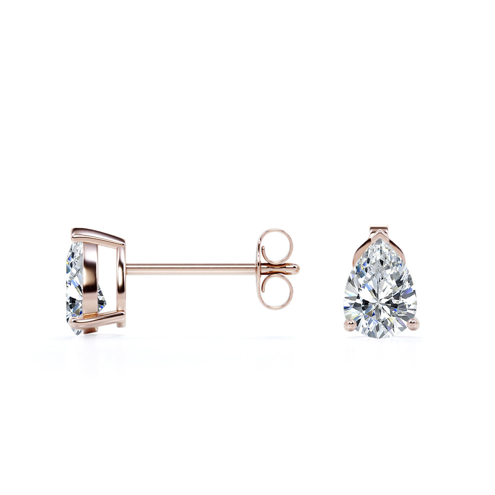 4 Carat Pear Cut Moissanite Minimalist Solitaire Stud Earrings In 18K White Gold Plating Over Silver