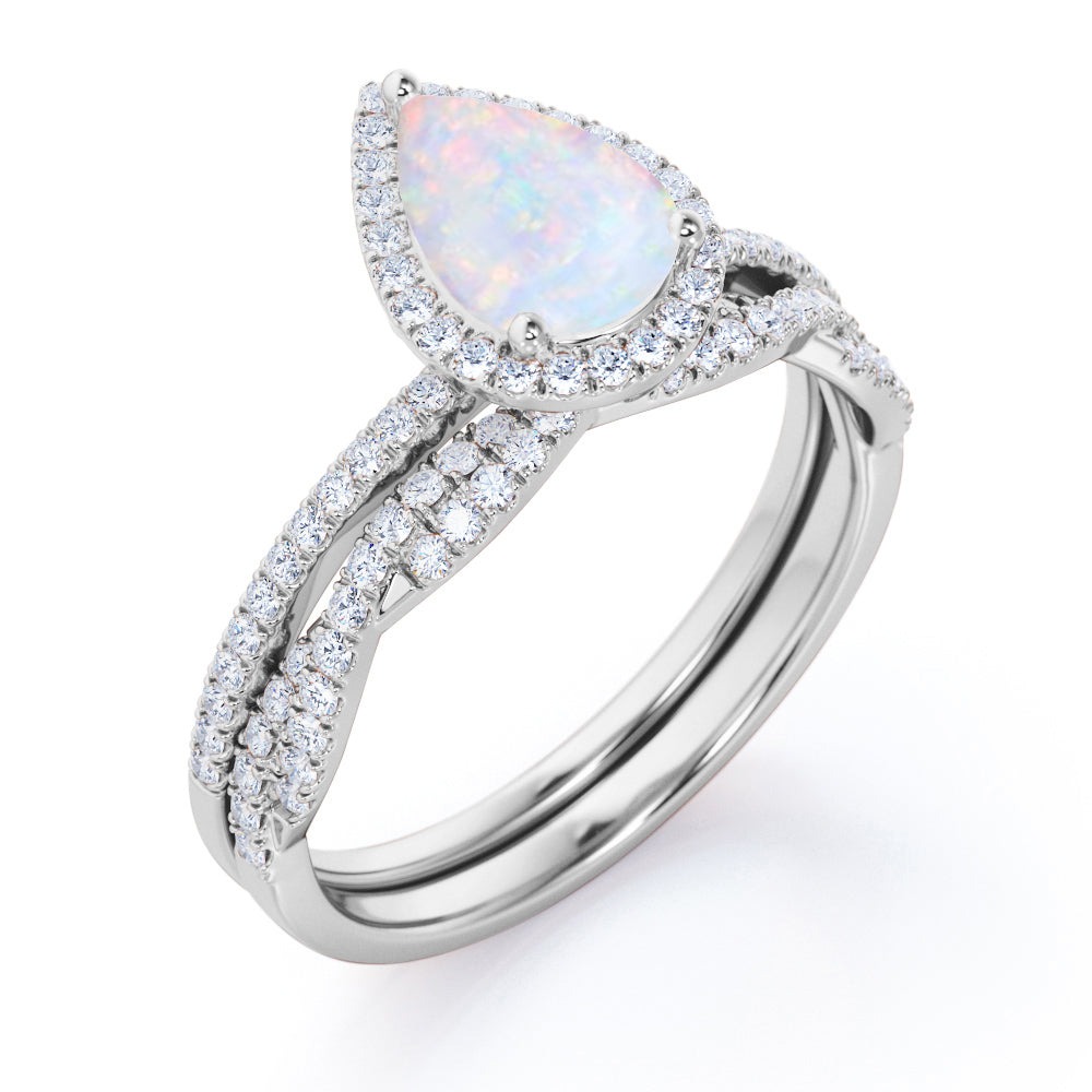 JeenMata 1.5 ct Pear Shaped Created Blue Opal and Moissanite Vintage Bridal Set - Infinity Twisted Wedding Ring Set in 18K White Gold Plating for Women