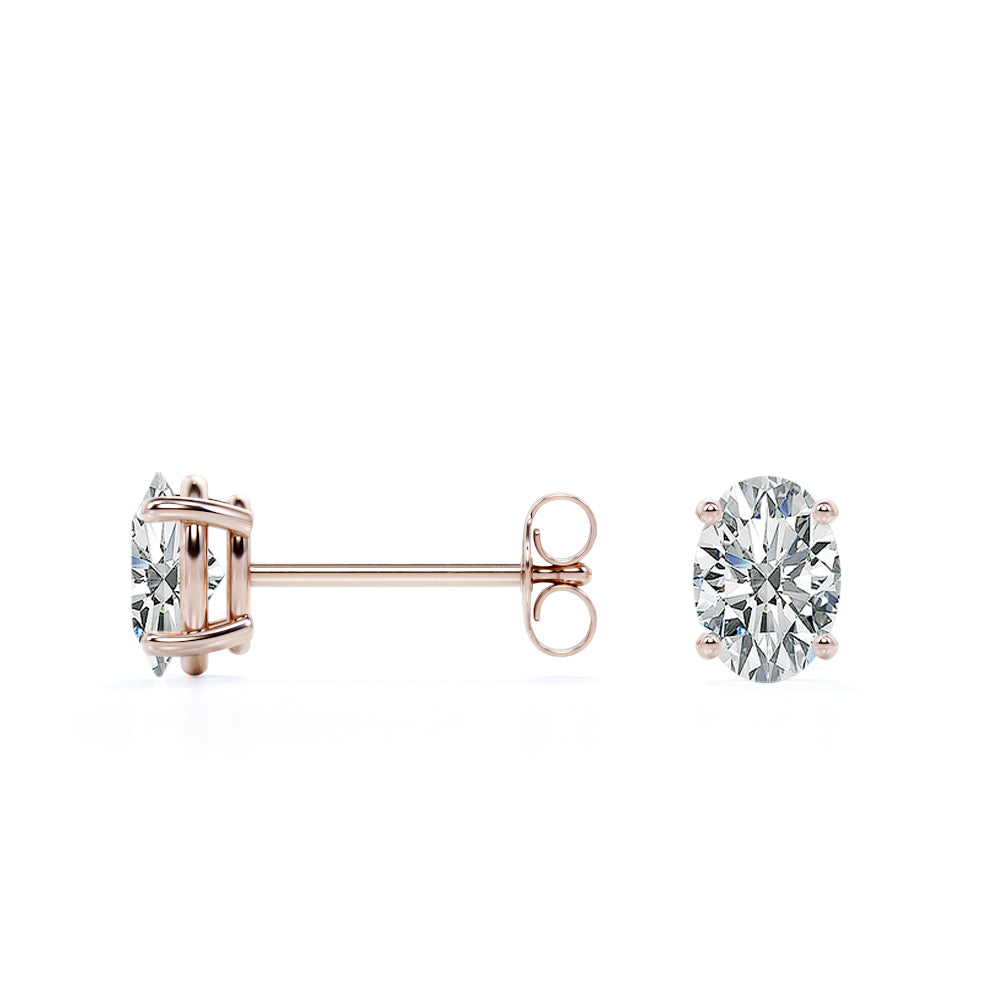 JeenMata 2 Carat Oval Cut Moissanite Solitaire Stud Earrings - 4 Prong - In 18K Rose Gold Plating Over Silver.