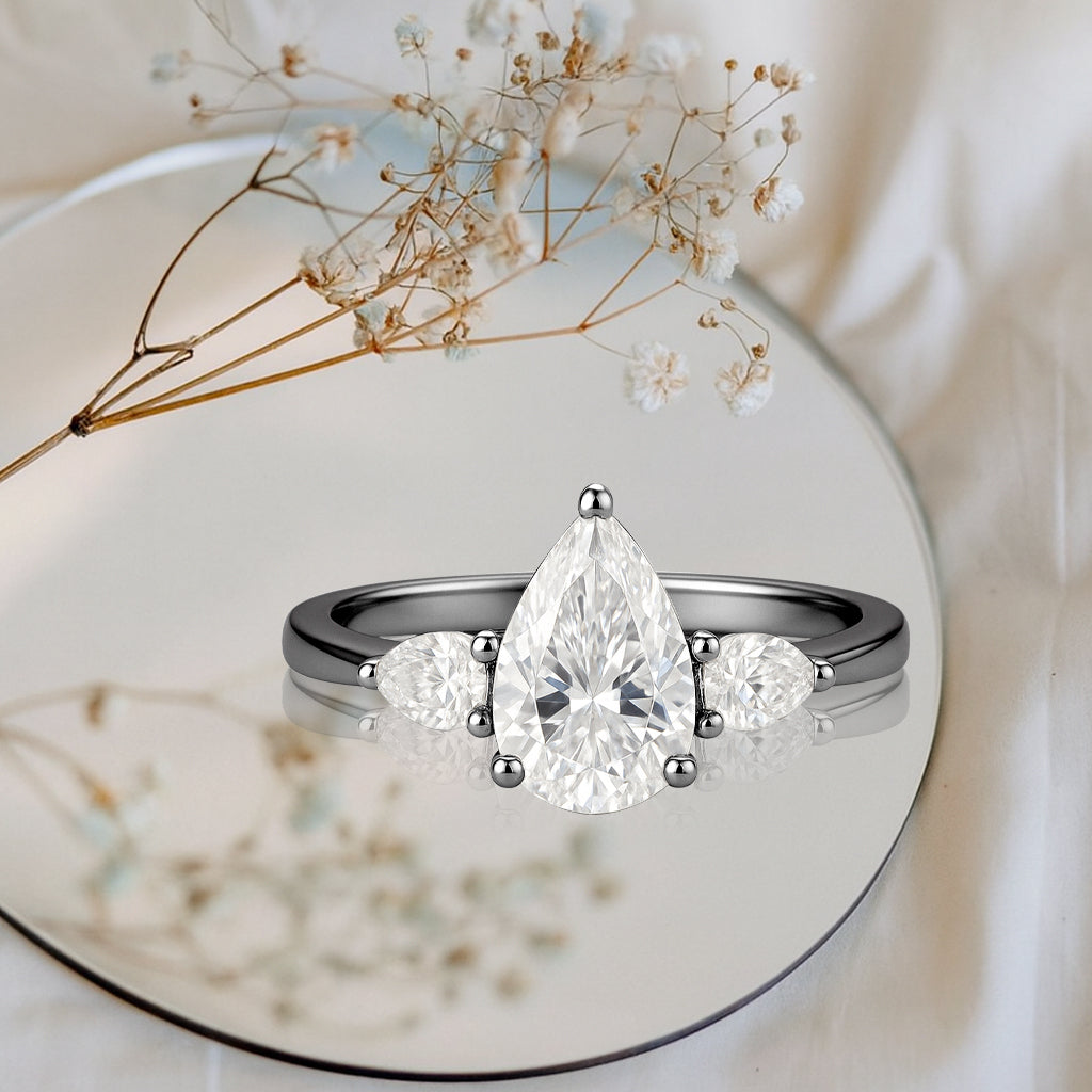 1.10 Ct Pear Moissanite Three-Stone Engagement Ring