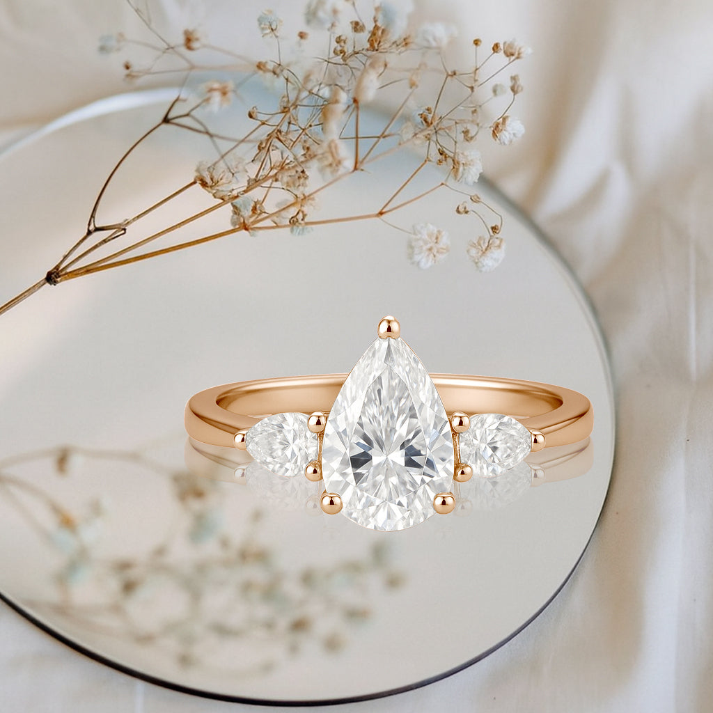 1.10 Ct Pear Moissanite Three-Stone Engagement Ring