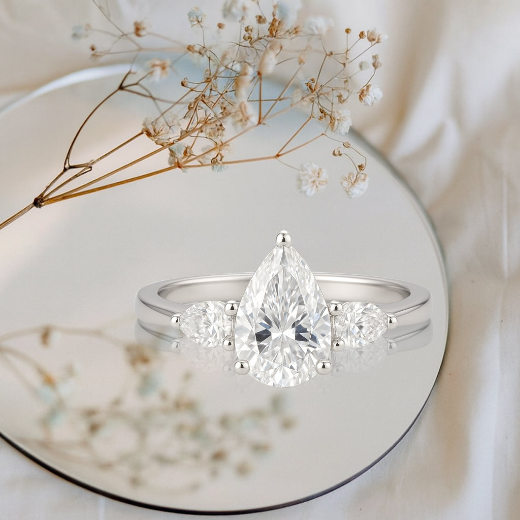1.10 Ct Pear Moissanite Three-Stone Engagement Ring