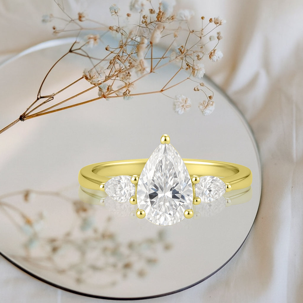 1.10 Ct Pear Moissanite Three-Stone Engagement Ring