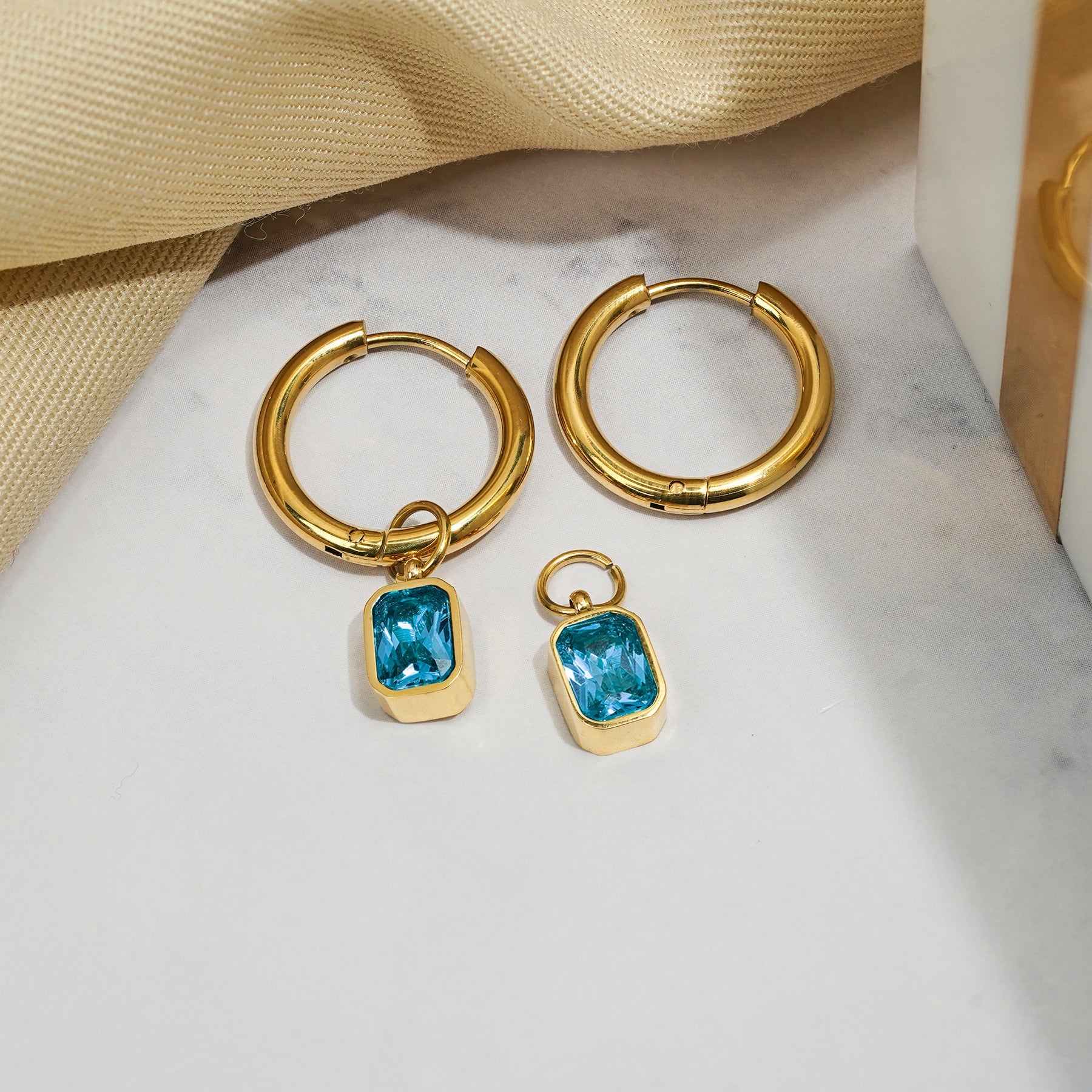 2 Carat Emerald Cut - Blue Topaz - December Birthstone Bezel Huggie Hoop Earrings - 18K Yellow Gold Plating