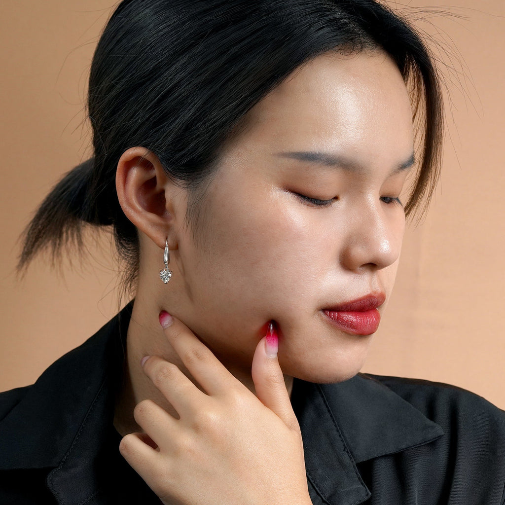 Enchanting 1.5 Carat Heart Shaped Moissanite Dangle Earrings in 18K White Gold over Silver