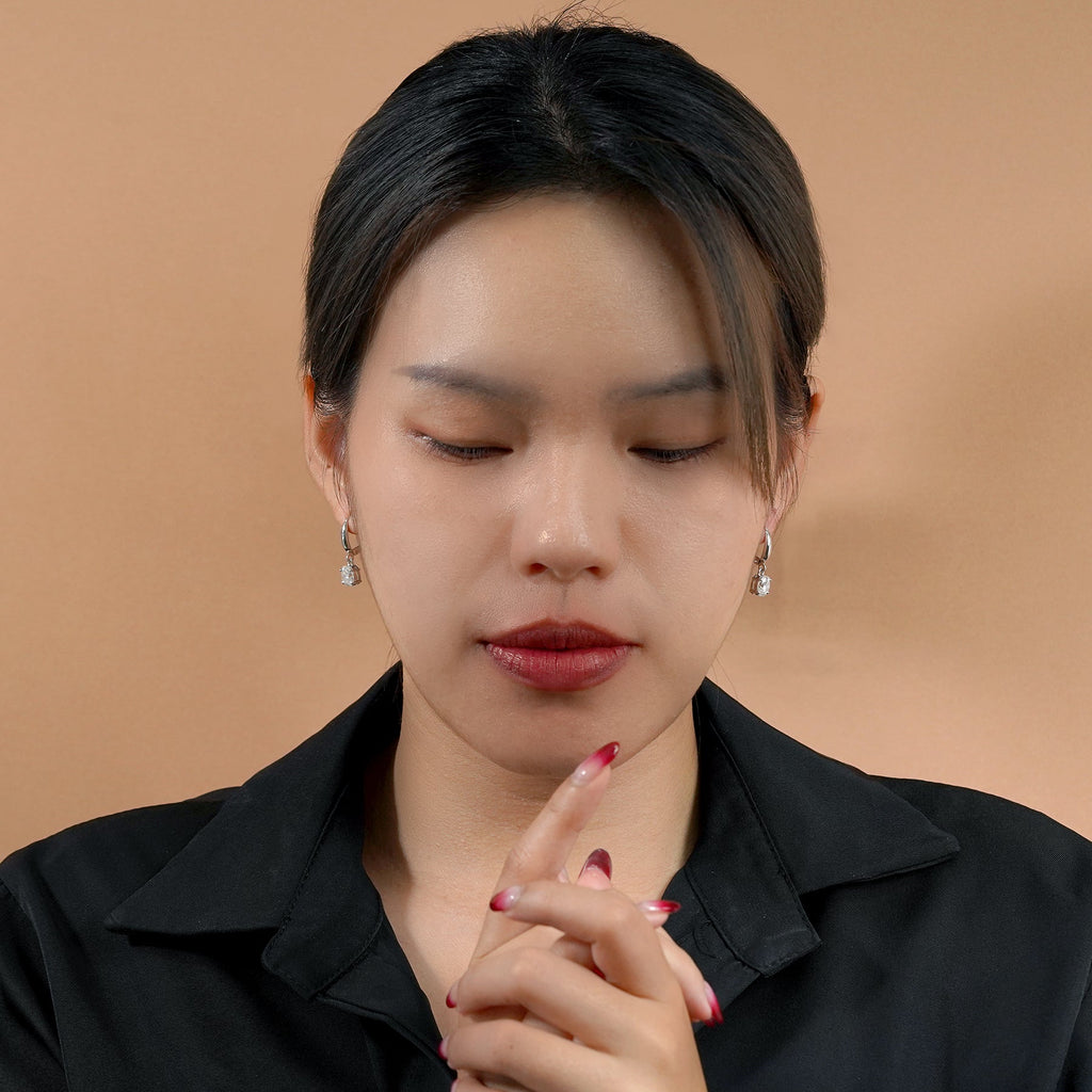 Elegant 2 Carat Oval Cut Moissanite Dangle Earrings in 18K White Gold over Silver