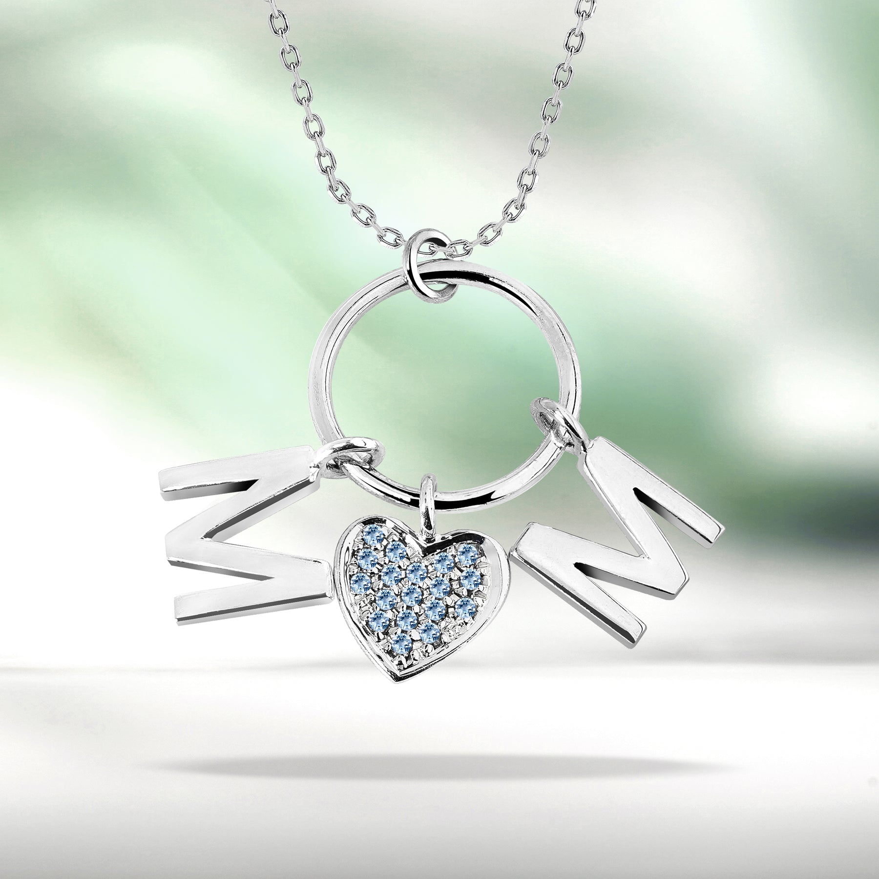 Circle Pendant with MOM Charms Pendant Necklace in 18K White Gold over Silver - Ice Blue Stone Embellished - March Birthstone