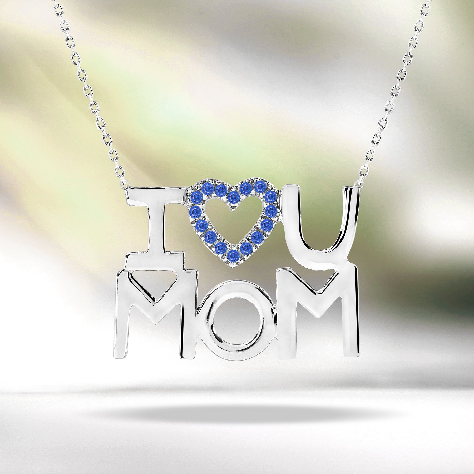 JeenMata I Love U Mom Dark Blue Stone Embellished Open Heart Pendant Necklace in 18K White Gold over Silver - September Birthstone - Gift for Mom