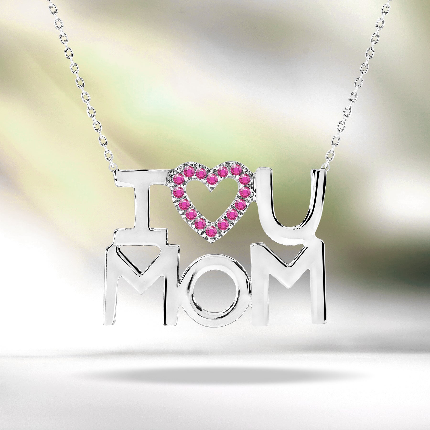 JeenMata I Love U Mom Strong Strong Red Stone Embellished Open Heart Pendant Necklace in 18K White Gold over Silver - July Birthstone - Gift for Mom